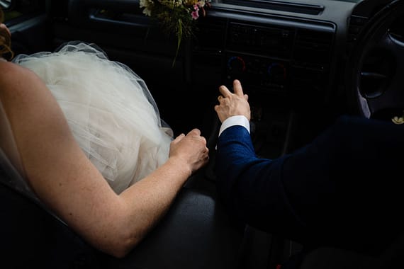 couple driving landrover micro wedding photographer