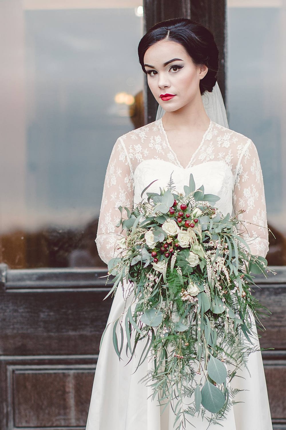 winter bride with bouquet at Grittleton house