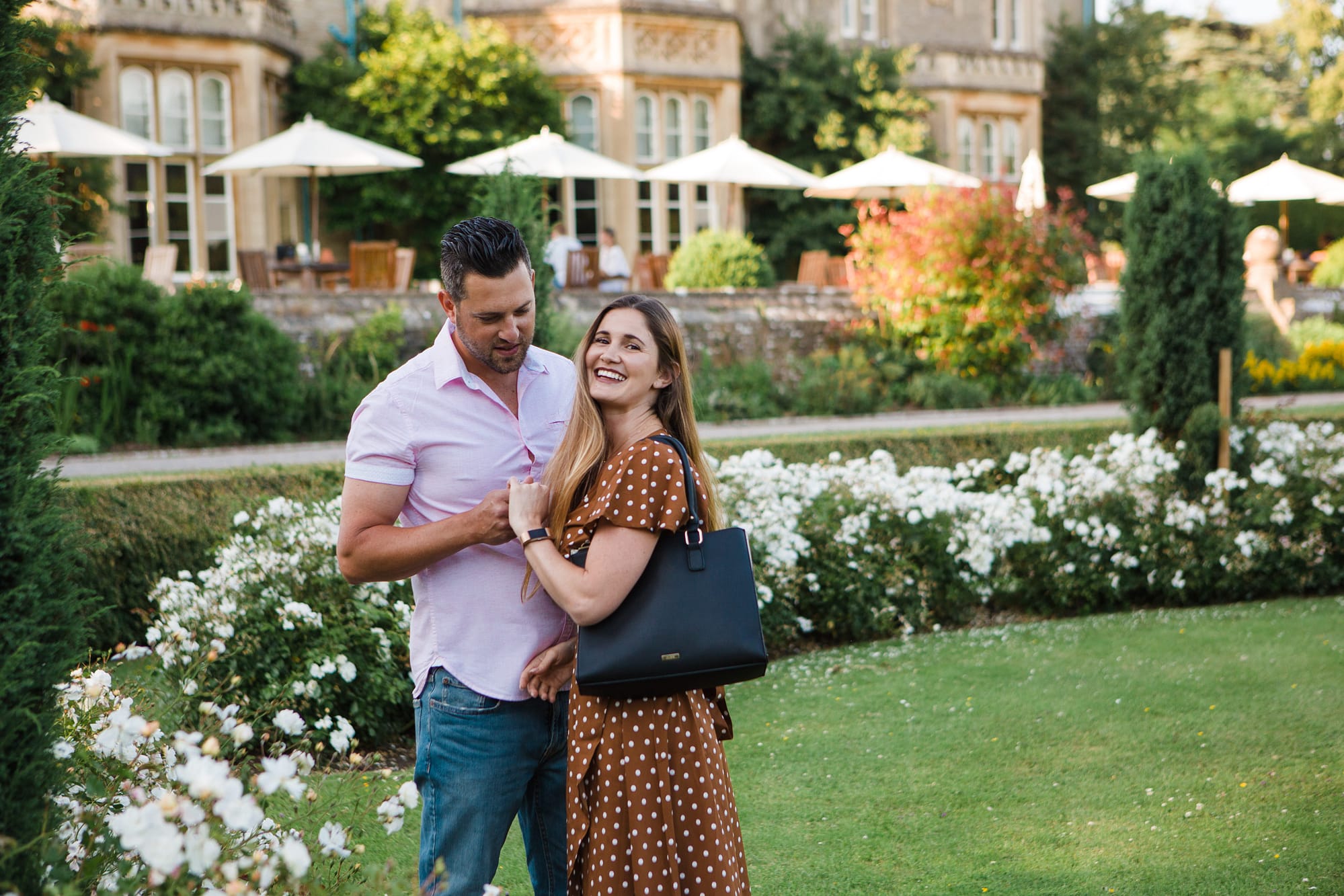 couple Tortworth court admiring ring at surprise proposal
