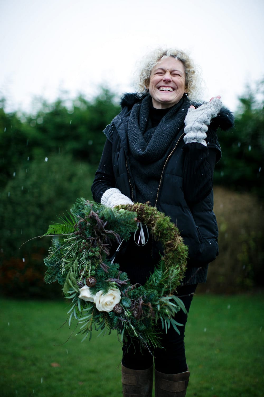wild and co florist laughing with snow 