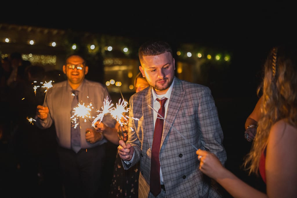 guests lighting Elmore court sparklers