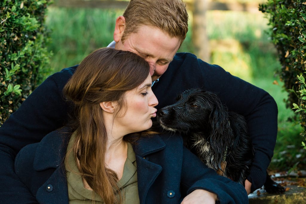lady kissing dog engagement shoot with Gloucestershire wedding photographer