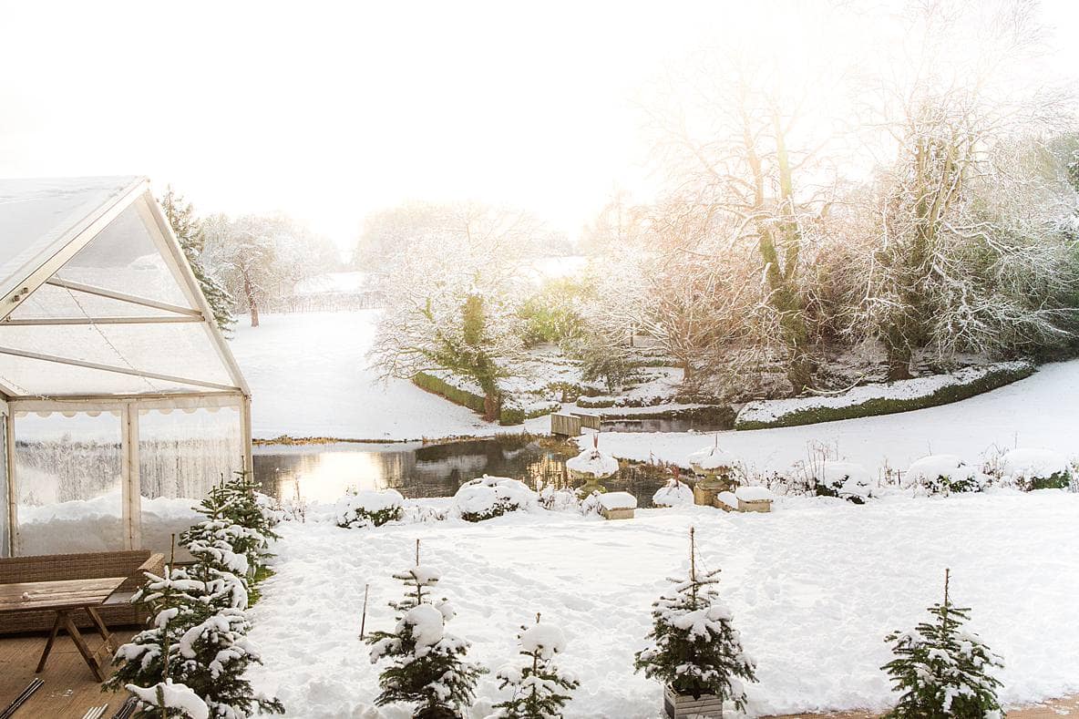 Cowley Manor marquee in snow scene wedding day