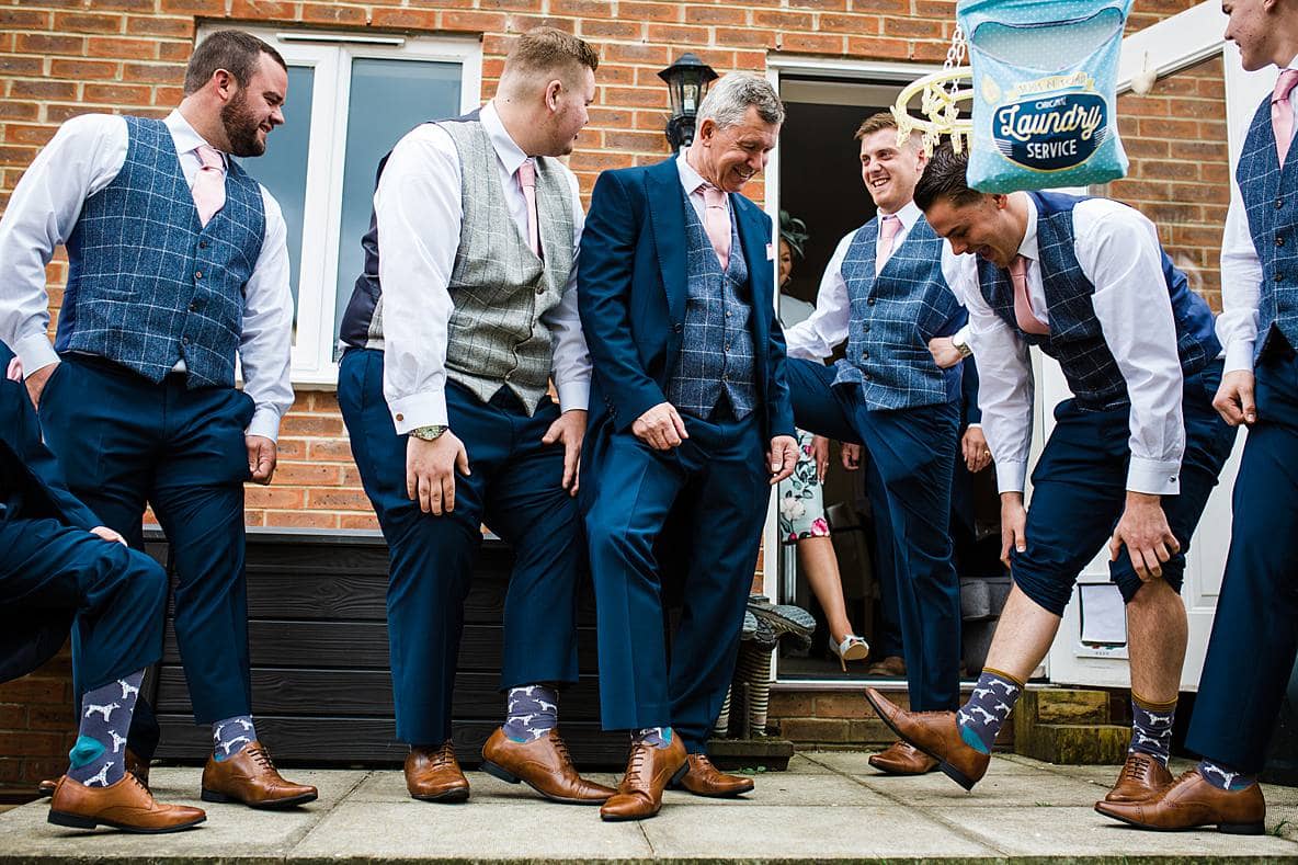 groomsmen with funny socks Kingscote Barn