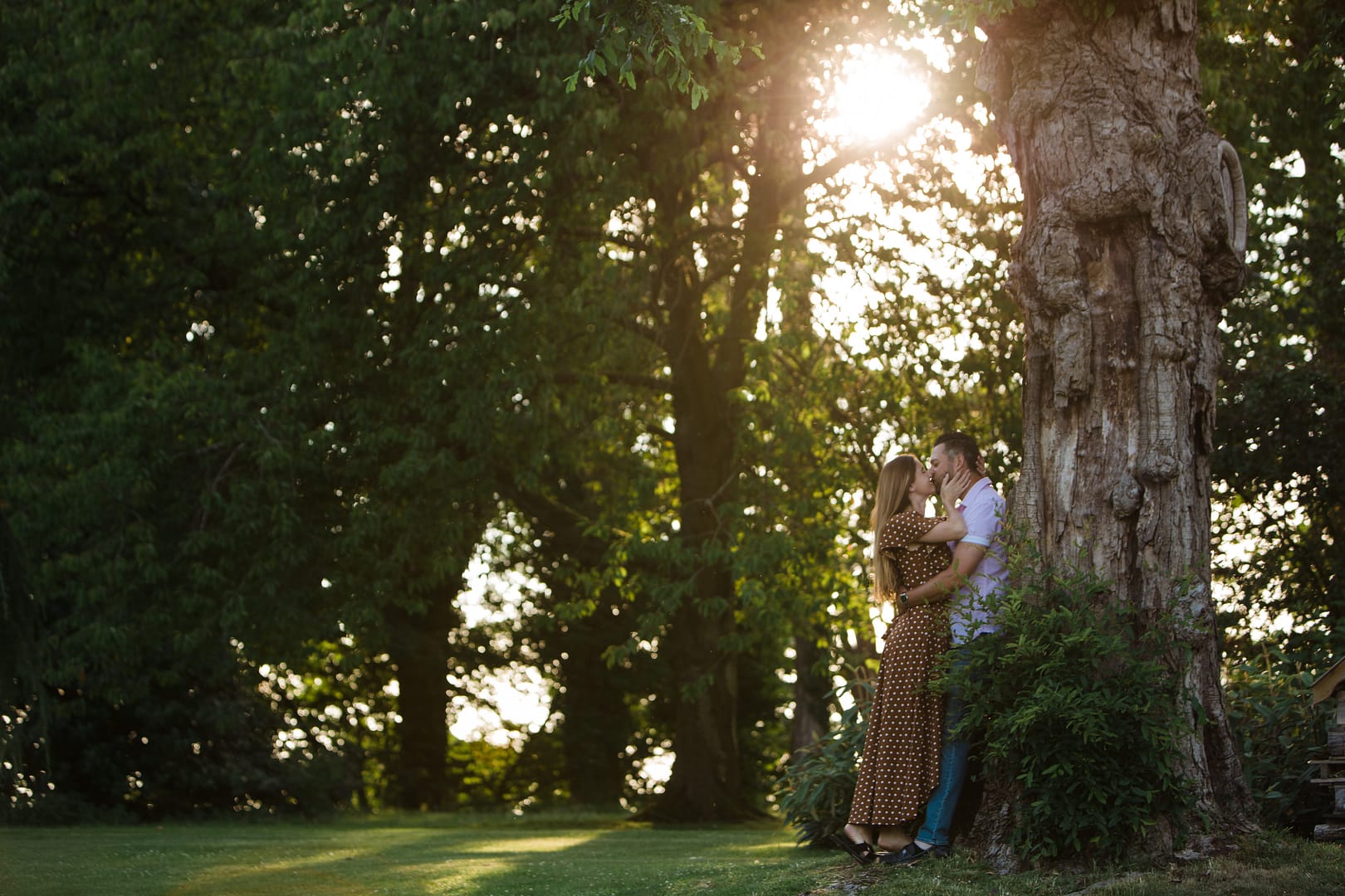 couple kissing under tree Tortworth court engagement photography 