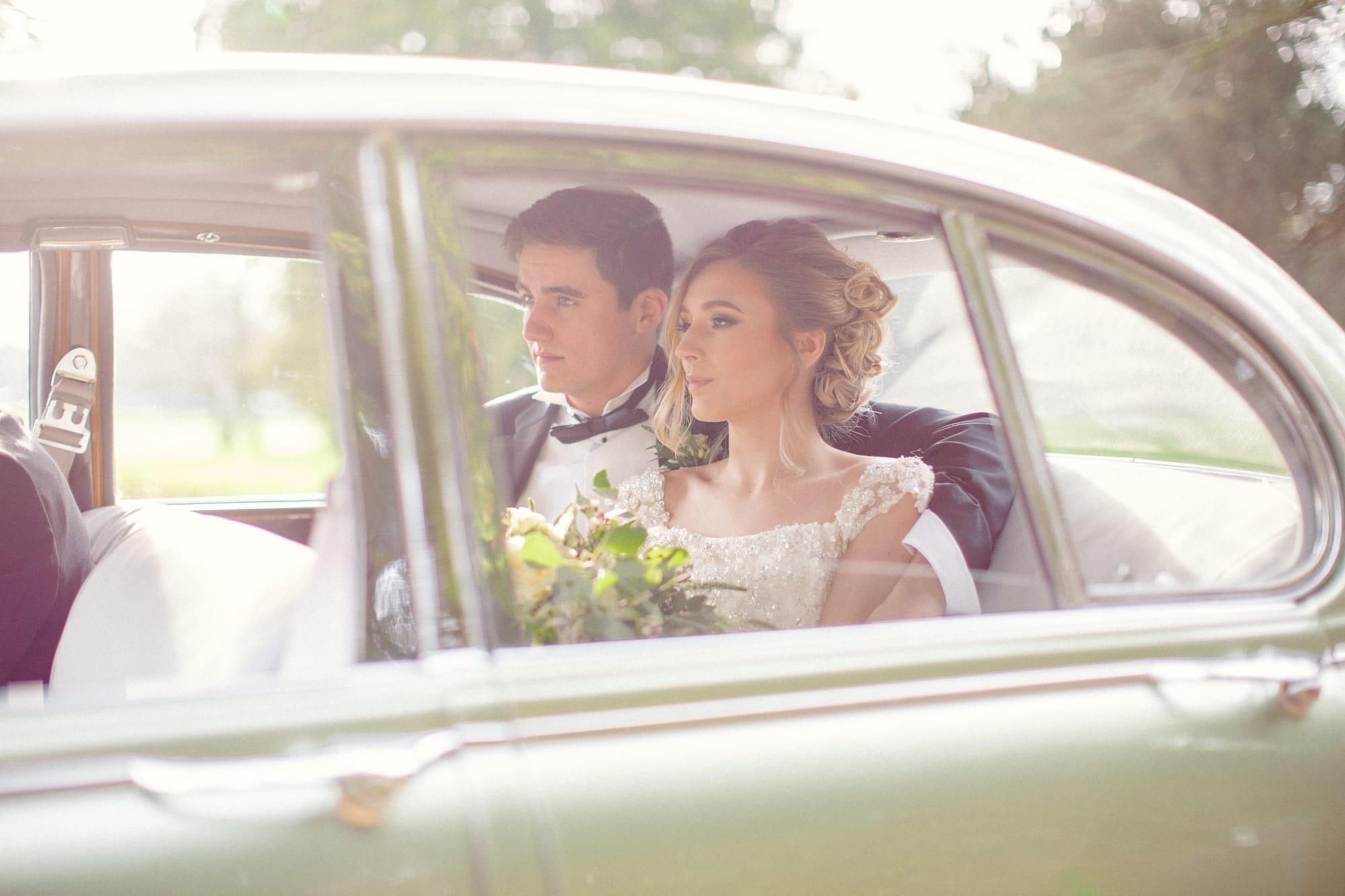 couple in car grittleton house wedding photographer