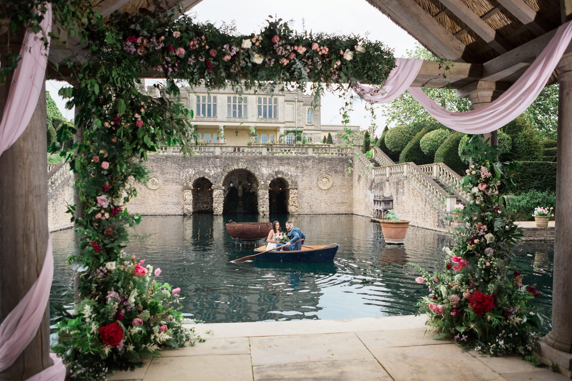 boathouse with flowers couple in boat wedding Euridge Manor 