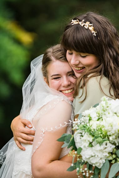 sister hug micro wedding photographer covid