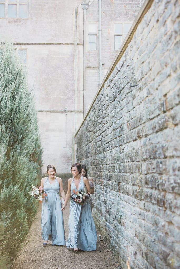 bridesmaids walking to gillyflower Elmore court wedding photographer