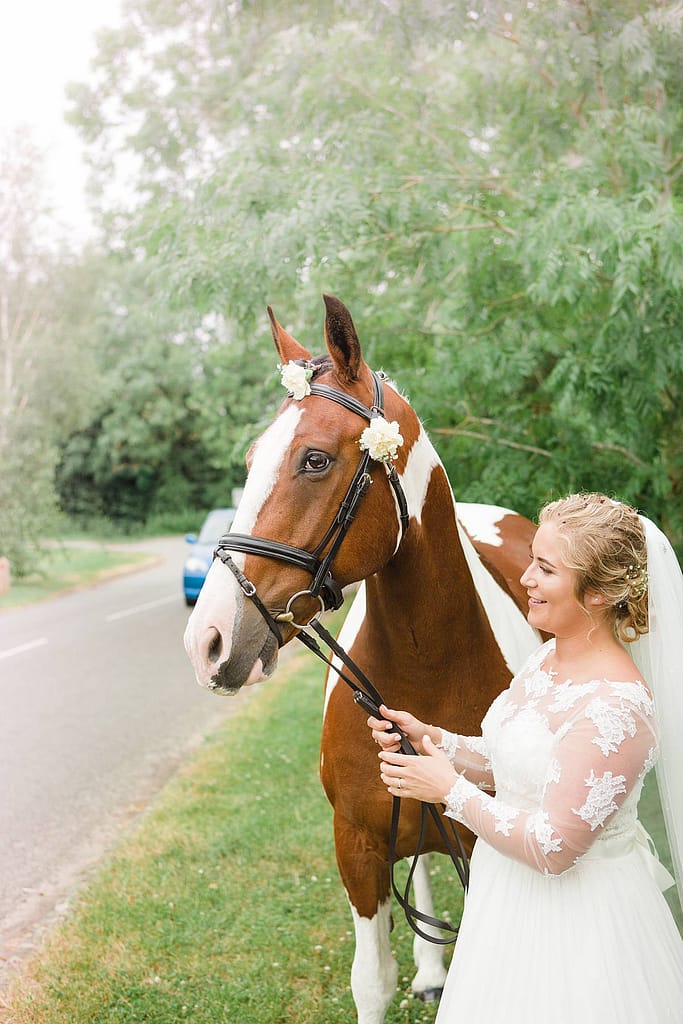bride with horse wedding day