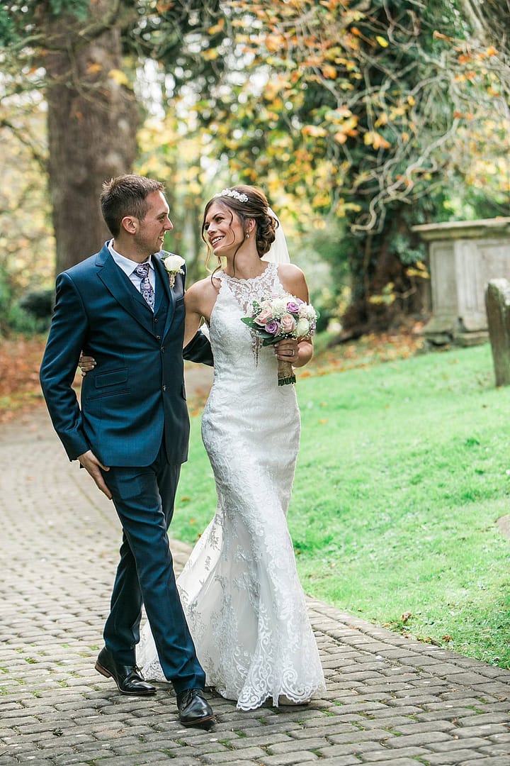 couple walking together laughing after gloucestershire wedding