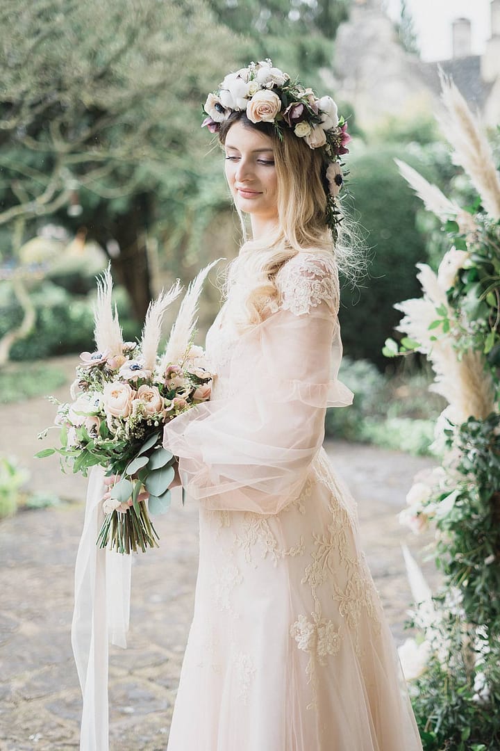 bride in peach wedding dress at Barnsley House for wedding photographer